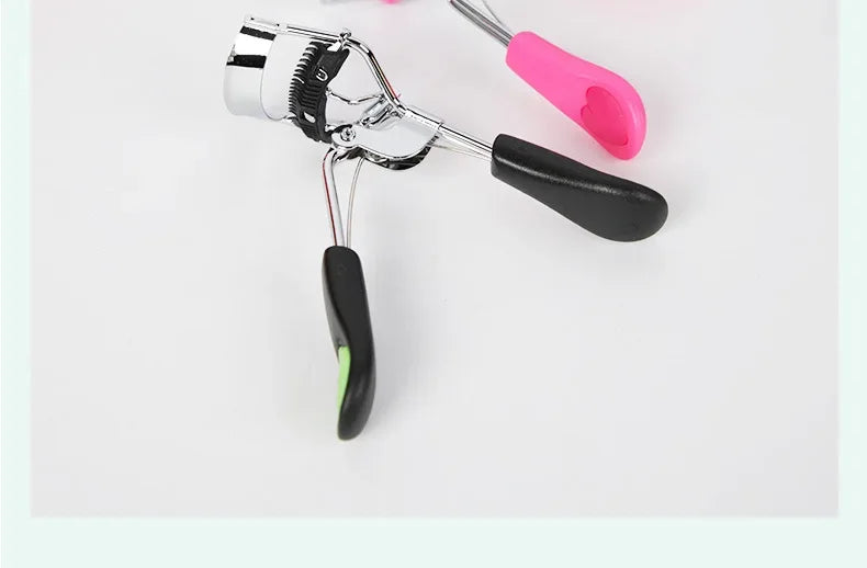 Black eyelash curler with comb